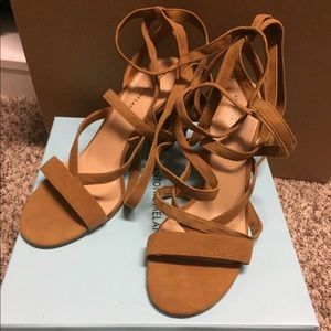 Brown suede strappy ankle wrap style heels.
